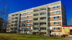 an apartment building with a flat roof