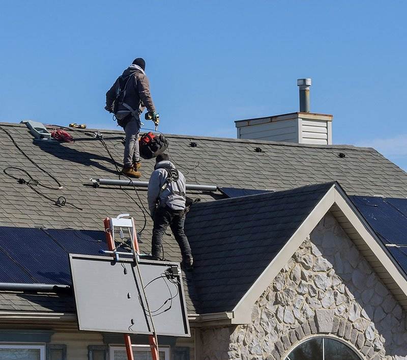 Crew installing solar panels Crew installing solar panels
