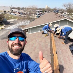 Thumbs up from team on top of a roof Dolan Roofing & Construction San Antonio, TX