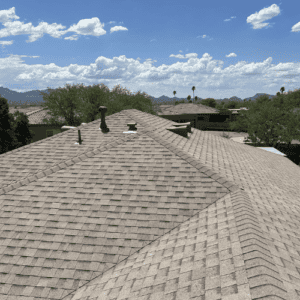 Clean and well-maintained asphalt shingle roof with two chimneys in San Antonio, TX