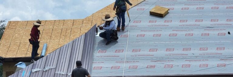Upgraded metal roof home in San Antonio, TX, after expert roofing and guttering installation.