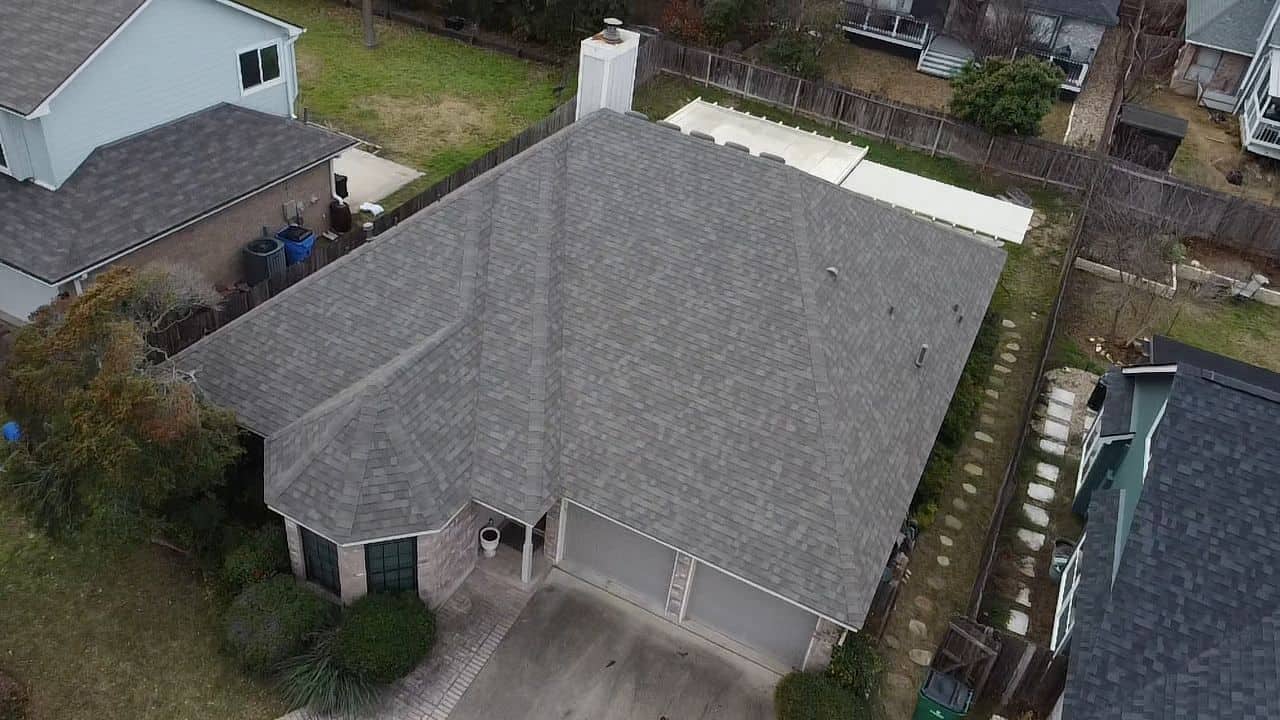Aerial view of newly installed Owens Corning Oakridge Driftwood shingle roof by Dolan Roofing & Construction in Oakridge