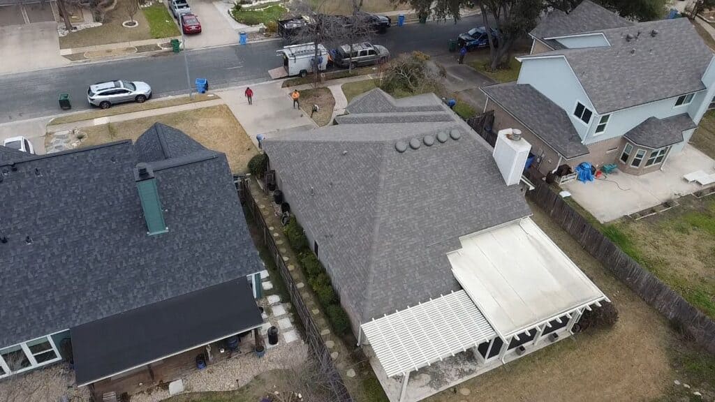 Back view of house featuring Owens Corning Oakridge Driftwood shingle roof by Dolan Roofing & Construction in Oakridge