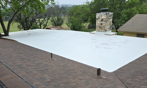 TPO installation next to asphalt shingles TPO and ashphalt shingle roofing systems installed in San Antonio, TX