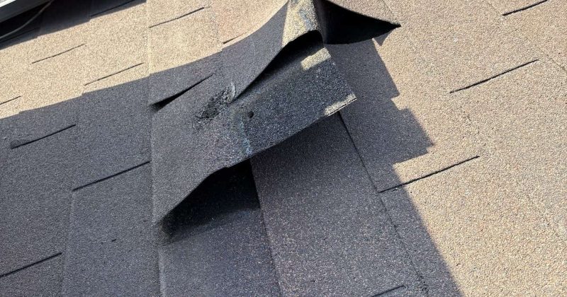 Roof damage caused by wind and hail in need of insurance-covered repairs
