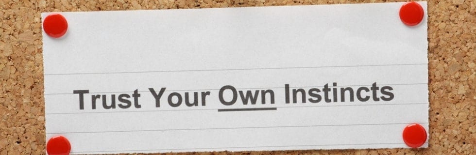 A sign on the corkboard reads, "Trust Your Own Instincts," secured by four red pushpins. In a way, it's like sticking to the maintenance plan for your HVAC system—reliable and reassuring.