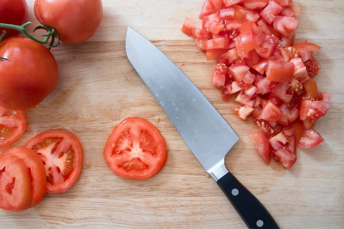 chopping fresh tomatoes