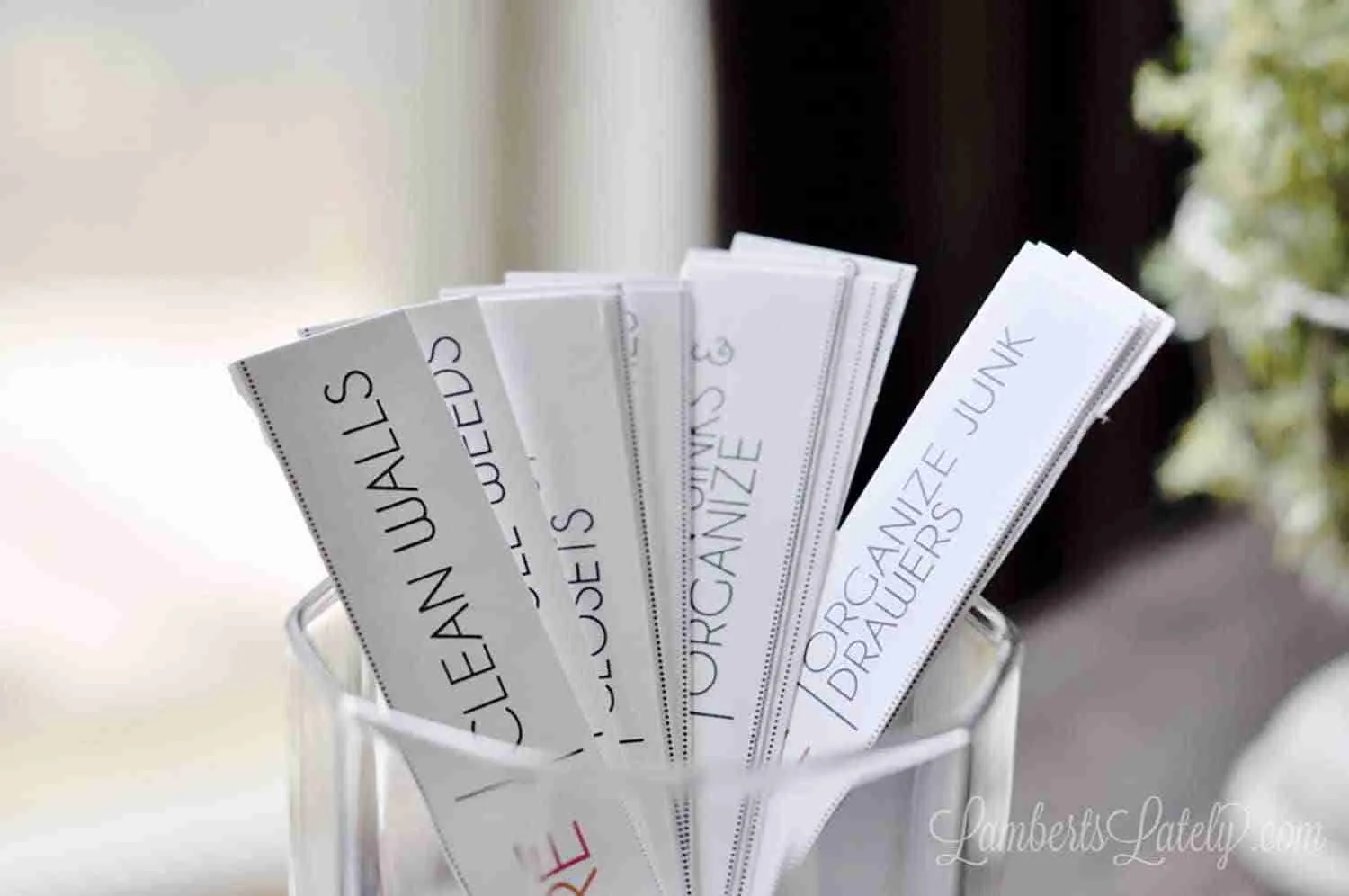 rectangular chore cards in a glass.