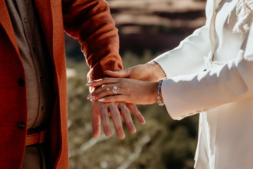 bride and groom show their wedding rings after getting legally married in Arizona