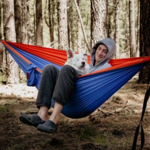 Evan Durazo in hammock with Aussie rescue