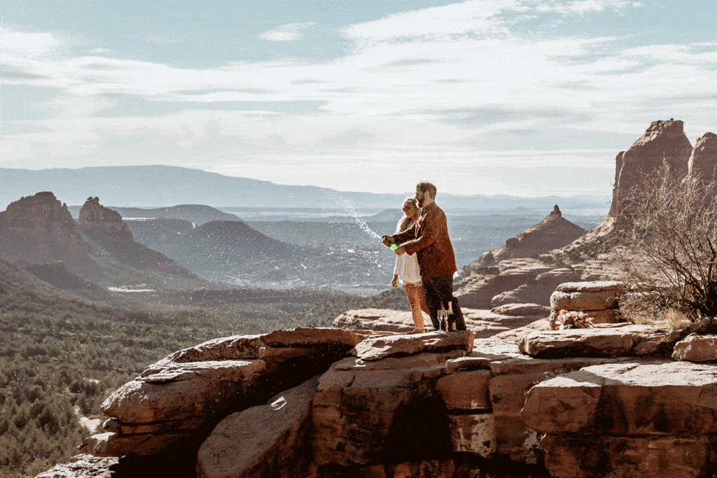 Champagne spray after Sedona elopement vows at Merry Go Round Rock