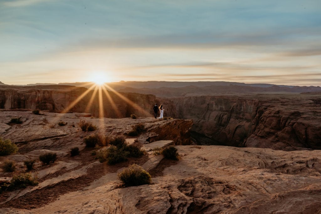 Wedding couple overlooking Horseshoe Bend at sunset