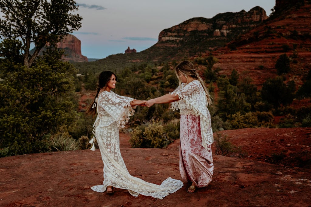 Best friends dancing and laughing during epic Sedona Sunset