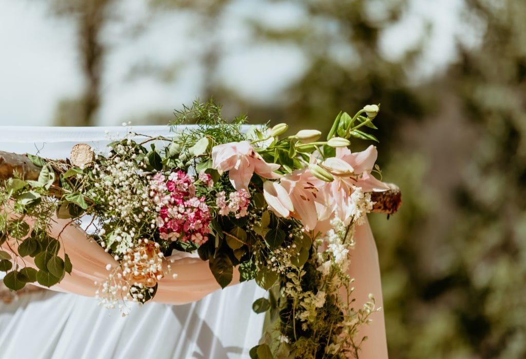 Lilies and wildflowers decorating Chuppah