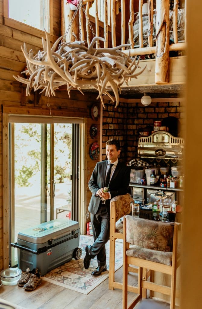 Groom waiting for bride to come downstairs