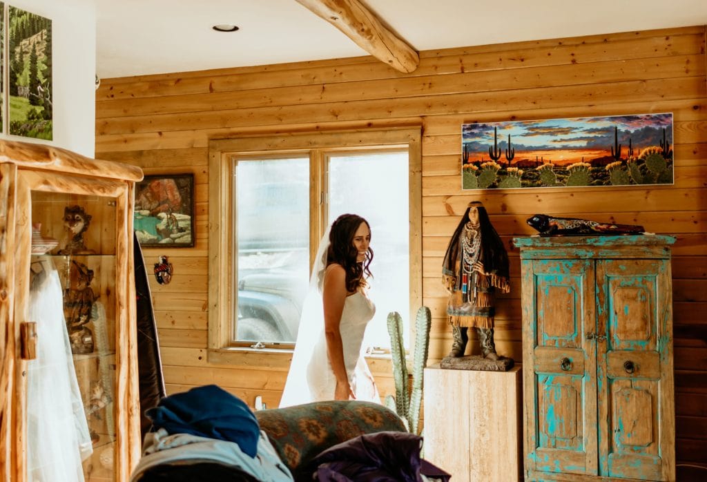 Bride walking downstairs seeing her groom for the first time