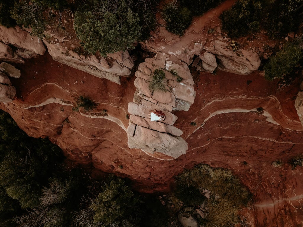 Overhead drone shot of a couple at the end of their off-road elopement day taken by Sedona elopement photographer