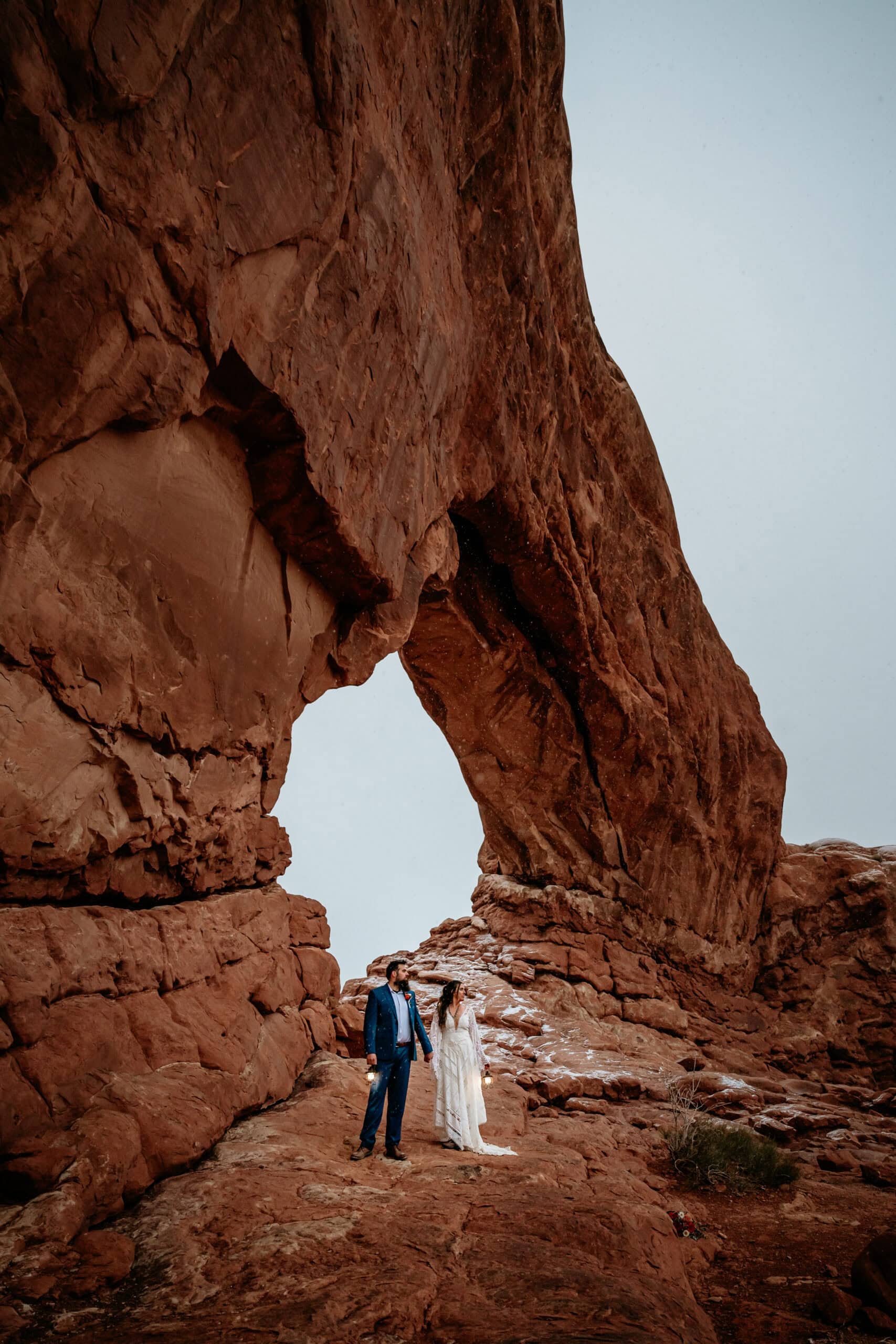 Couple standing under an arch during their Moab Elopement in Utah