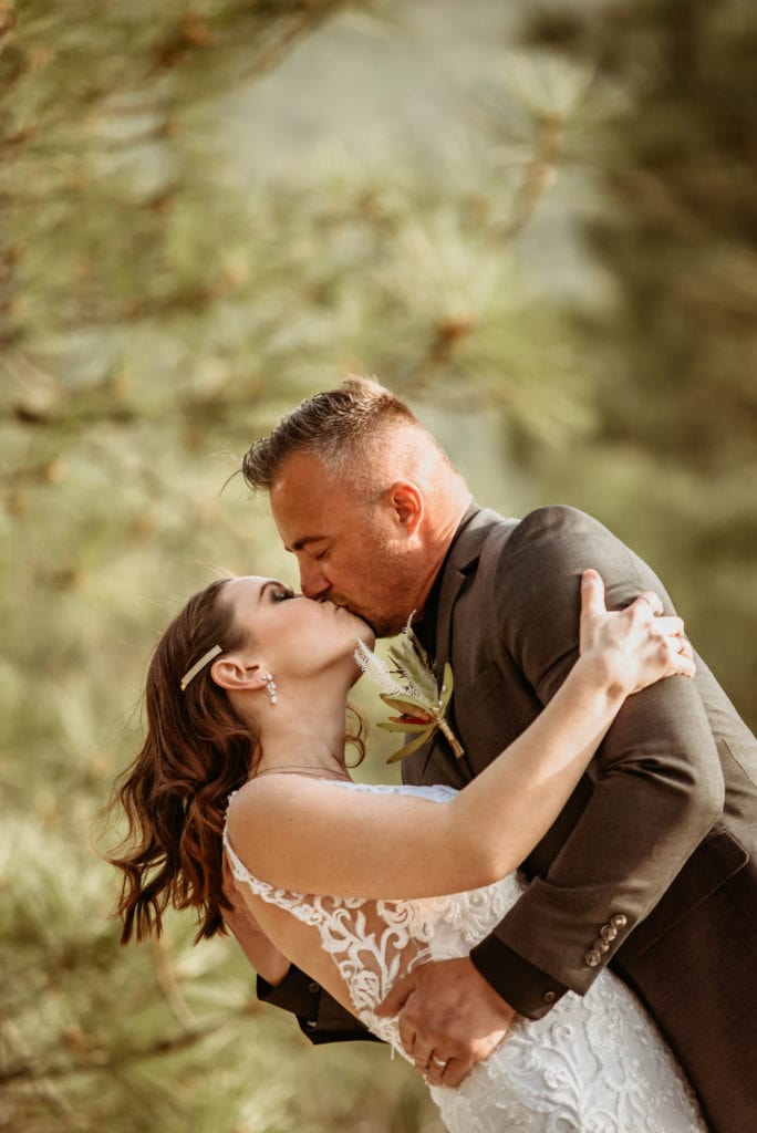 Bride and groom embrace in a romantic kiss during their northern Arizona elopement