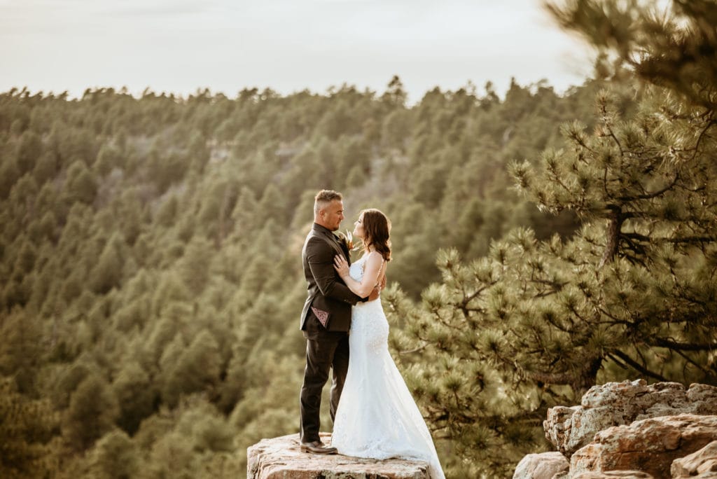 Sun glowing around this newly married couple on the edge of the Mogollon Rim