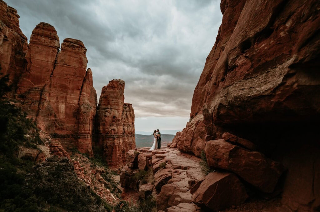 Couple on red rock at Sedona for Arizona elopement by Stratus Adventure Photography