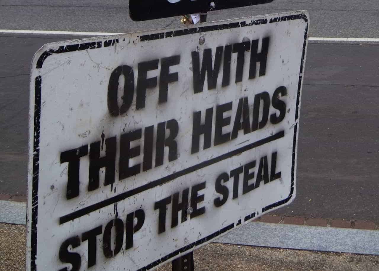 stop the steal: evolution and activities of the movement 5 A sign that says, “off with their heads, stop the steal”