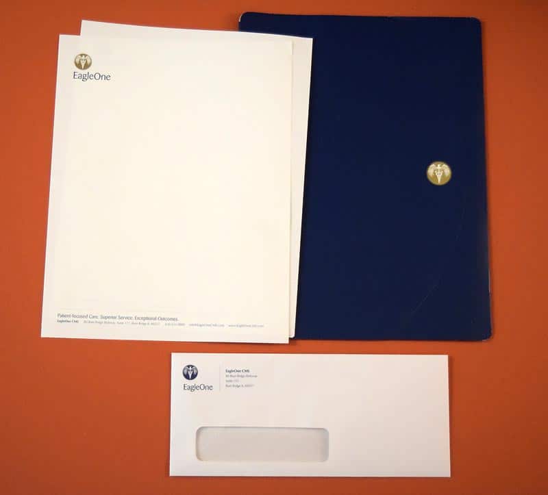 Eagle One branded stationery, folder and envelope.