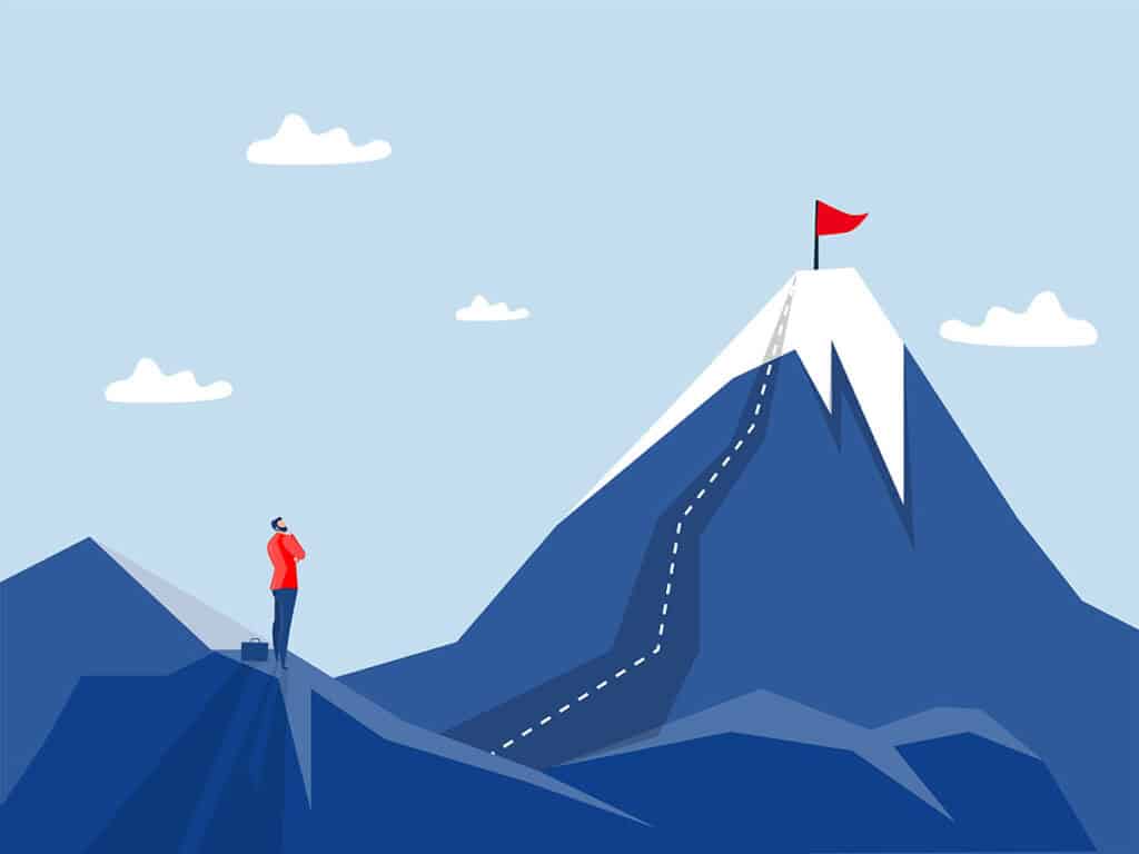 Climber eyeing the journey to the top of a mountain.