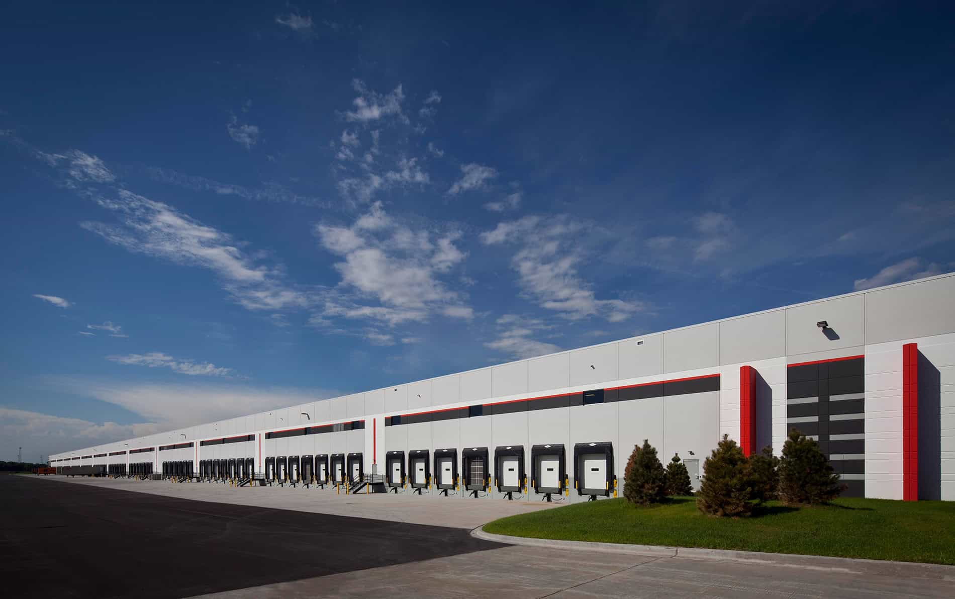 A long shot of an industrial building with gates. Keeley Construction handled the new construction for Weber-Stephen.
