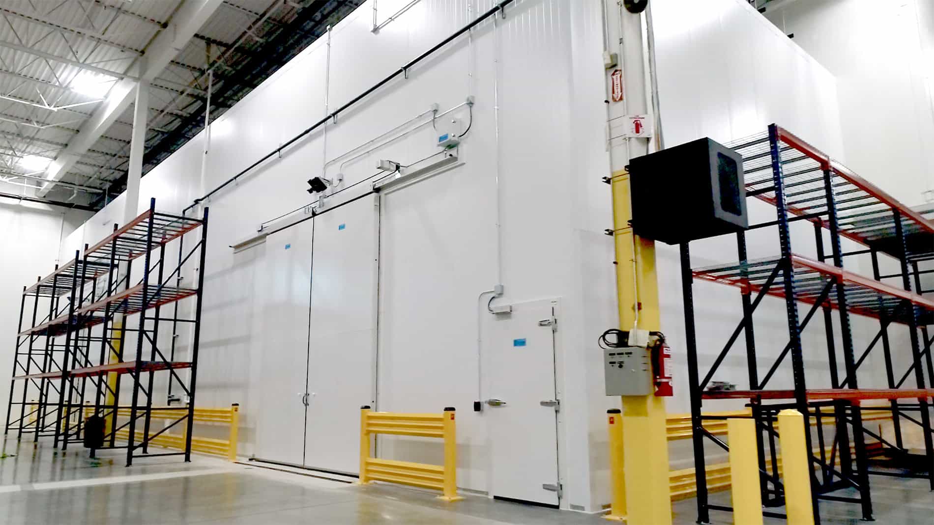 A side view of a large cooler in a warehouse owned by Nippon Express.