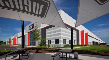 A fish-eye view of the Weber facility from the covered outdoor gathering space, complete with picnic tables.