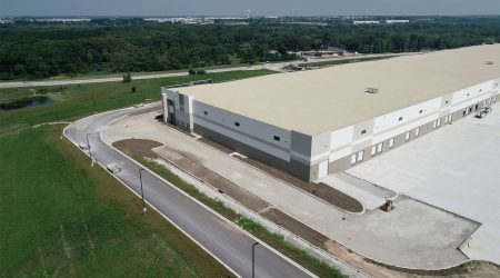 An aerial view of the First Joliet Logistics Center, a white industrial building.