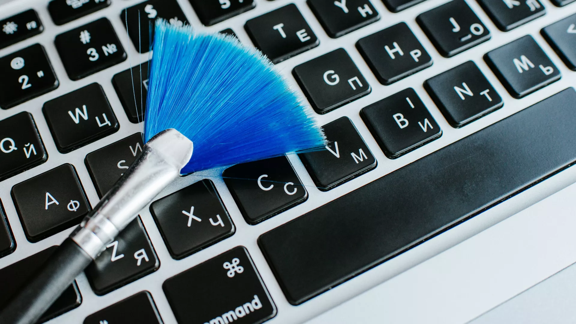 Clean Macbook Keyboard, Free From Dust And Debris, Representing The Contents Of The Article.