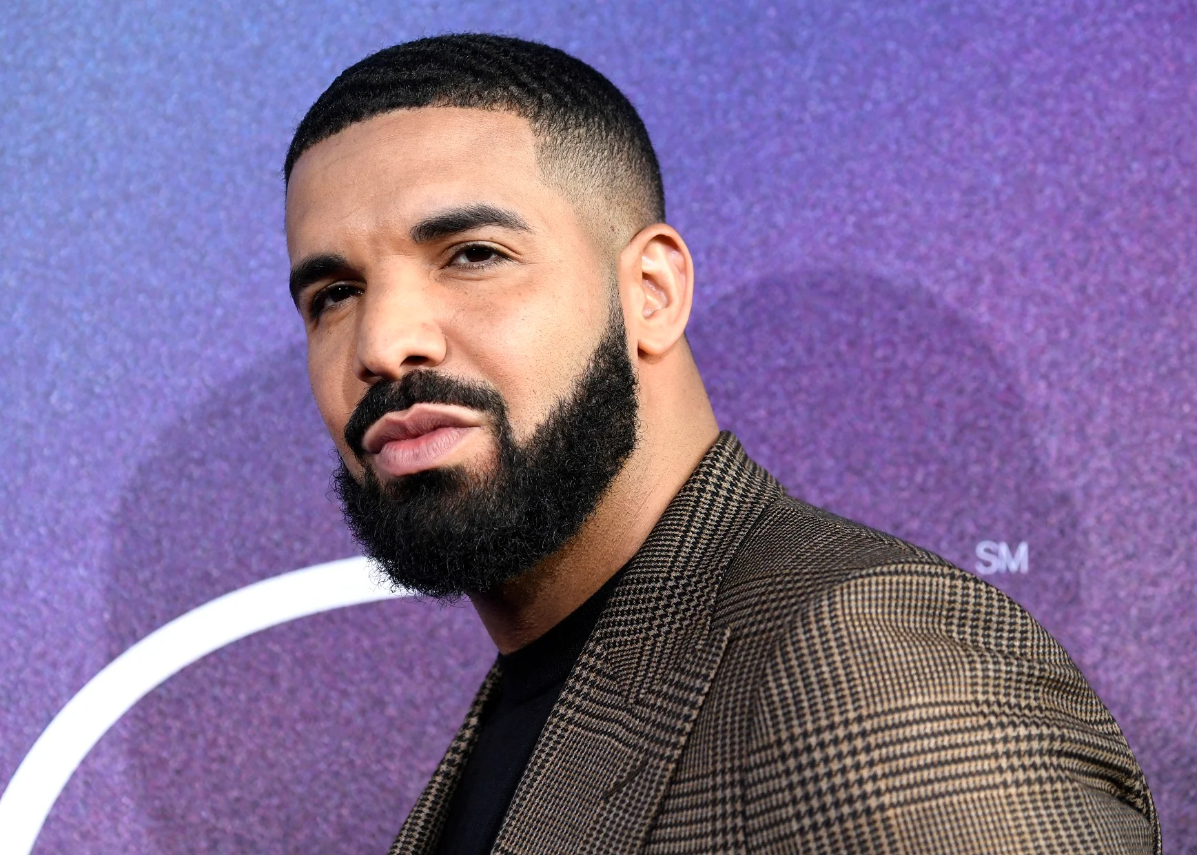 Drake In The Spotlight, A Symbol Of Fame And Fortune.