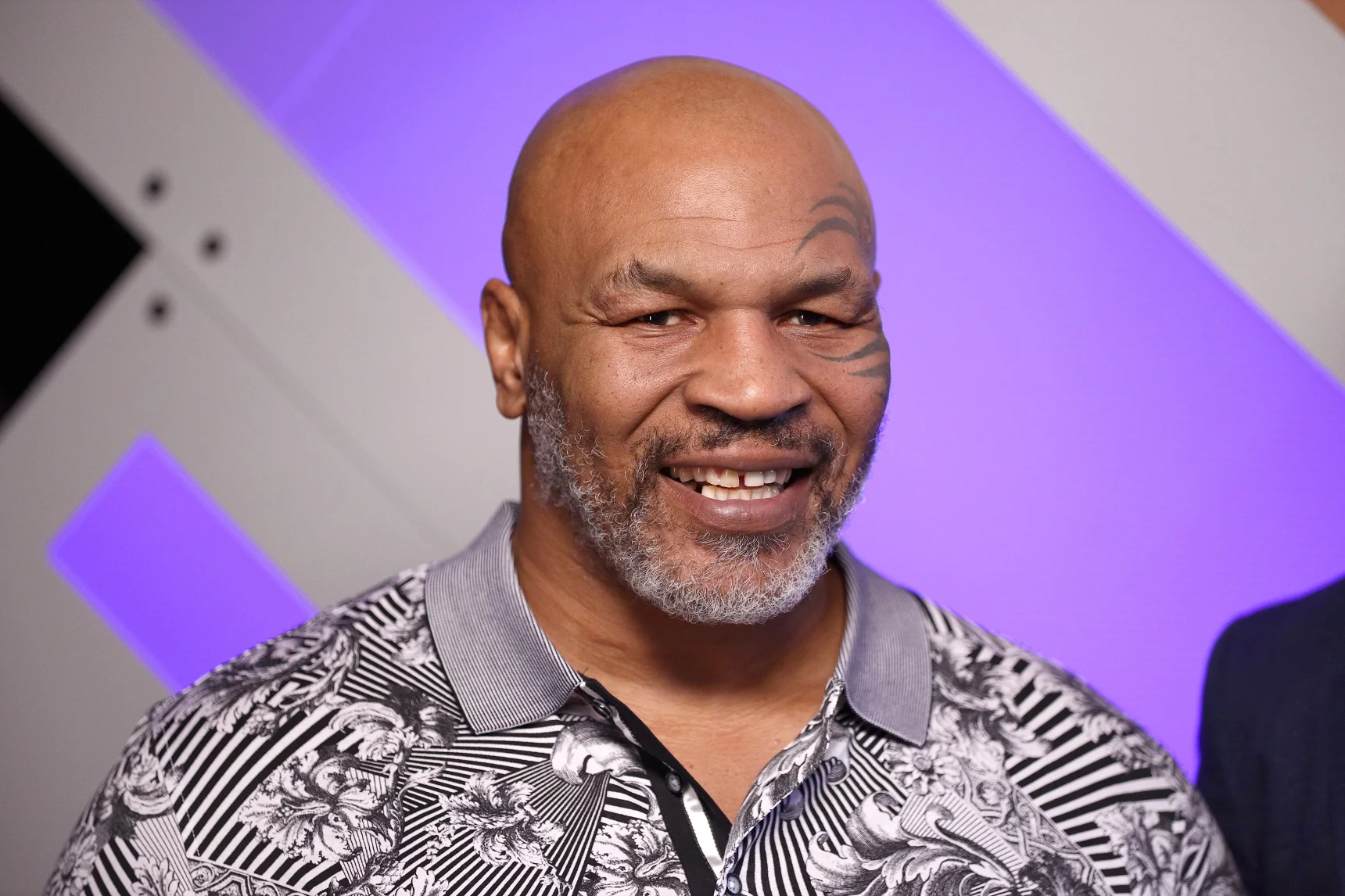 Mike Tyson'S Journey From Rags To Riches, Capturing His Boxing Prowess And Financial Success.