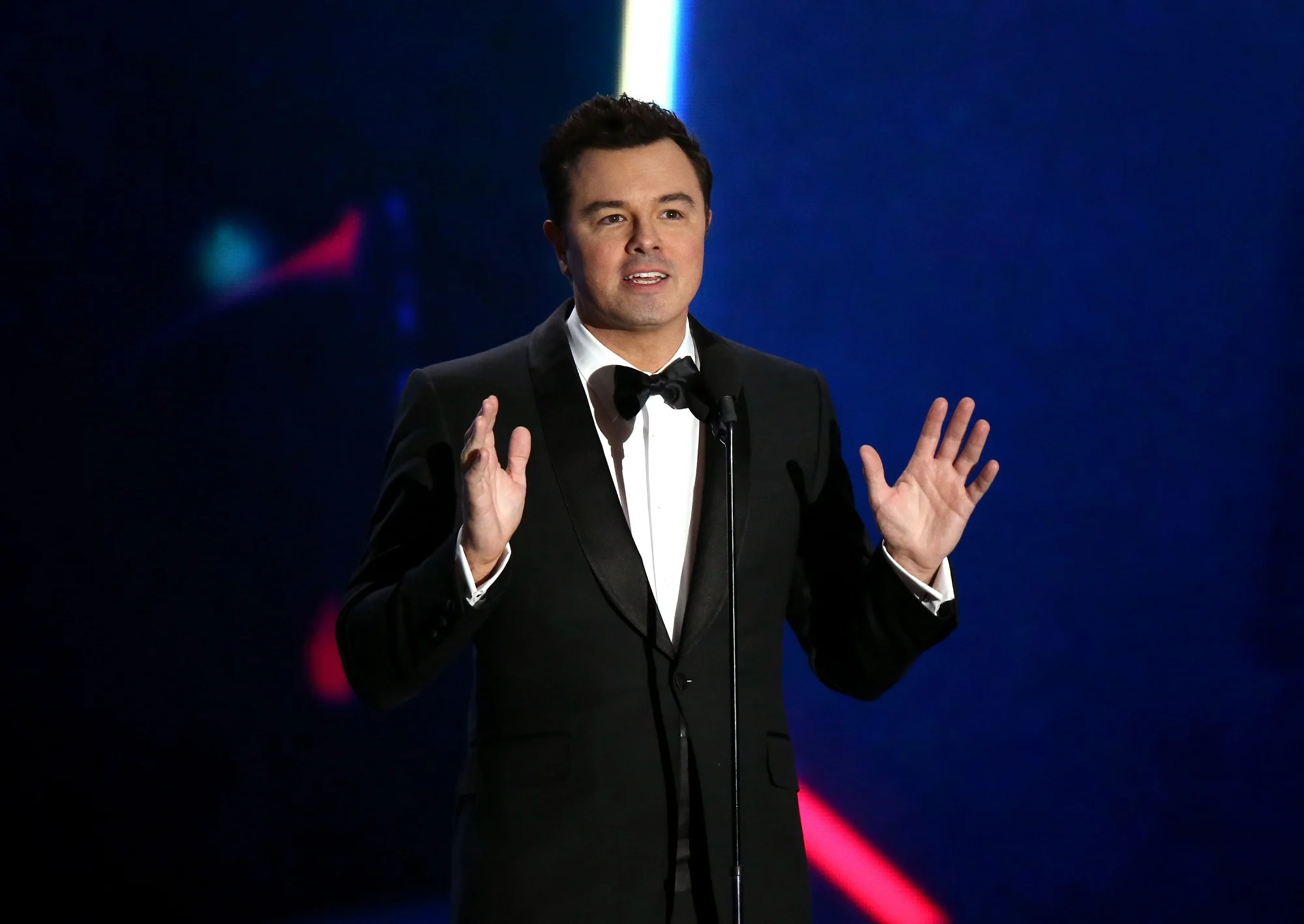Seth Macfarlane At The Microphone, Representing His Comedy Career And Success.