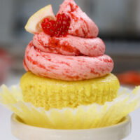 image of strawberry lemonade cupcakes decorated with a little lemon slice and cute heart shaped strawberry slice