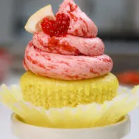 image of strawberry lemonade cupcakes decorated with a little lemon slice and cute heart shaped strawberry slice