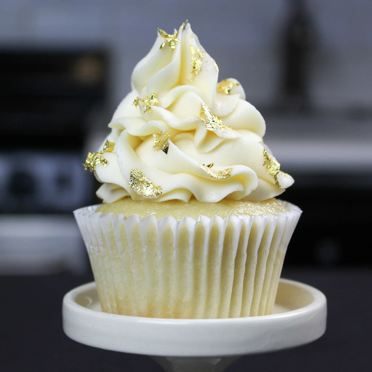 image of vanilla cupcake decorated with edible gold leaf