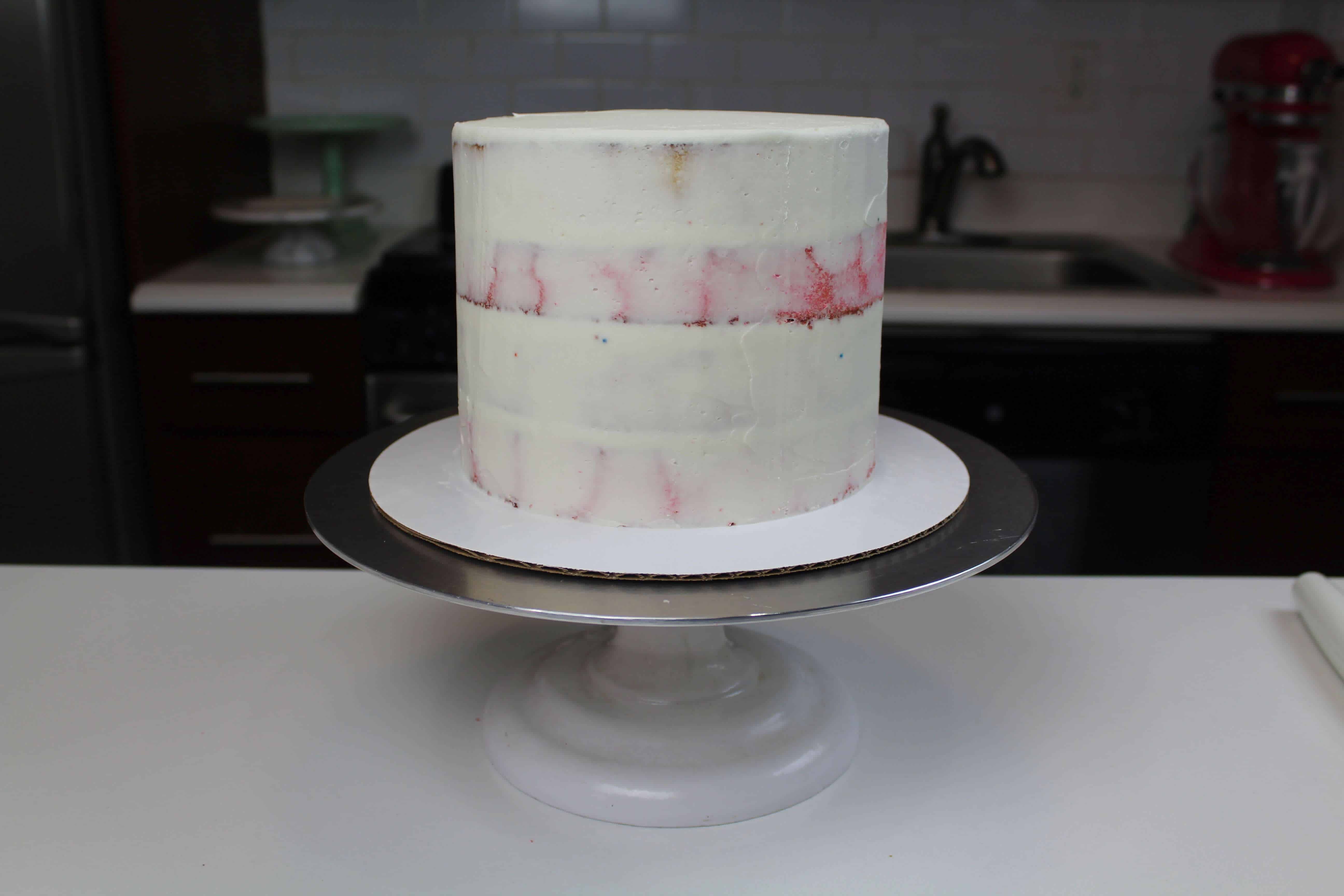 circus animal cake crumb coat