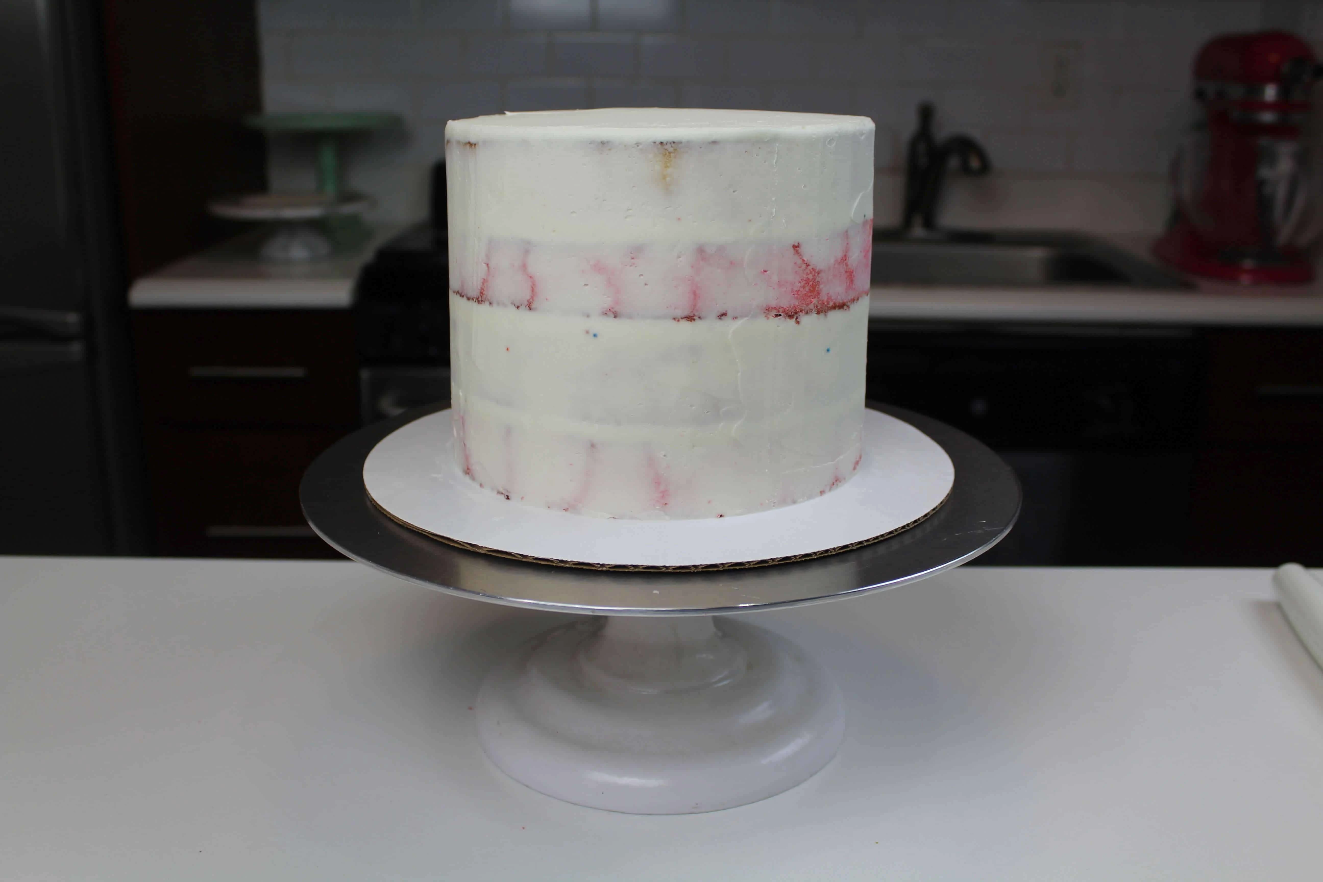 circus animal cake crumb coat