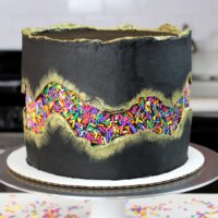 photo of funfetti cake decorated with a sprinkle fault line