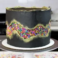 photo of funfetti cake decorated with a sprinkle fault line
