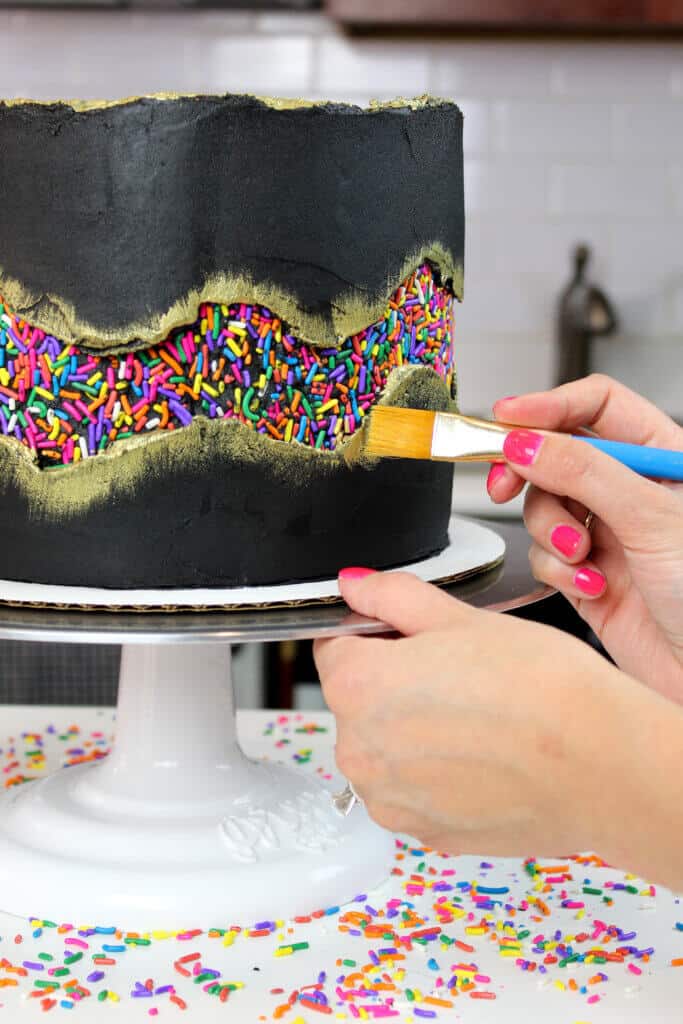 Painting gold onto my sprinkle funfetti cake photo