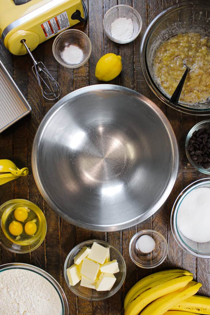 image of ingredients laid out to make banana bread, including ripe bananas