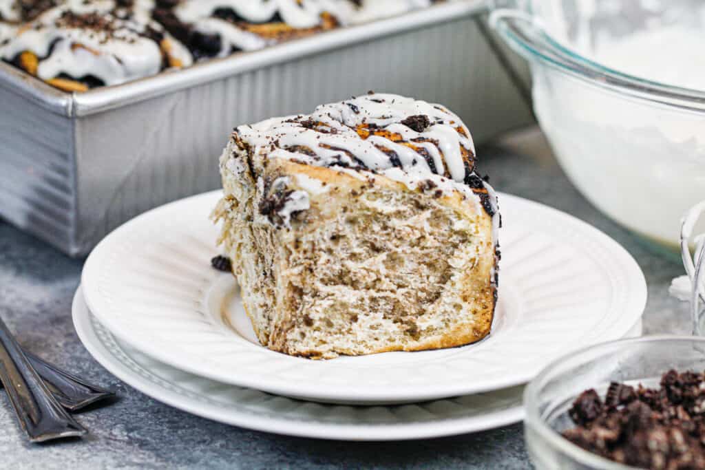 image of cinnamon roll with dark chocolate oreo filling baked and on plate ready to be eaten