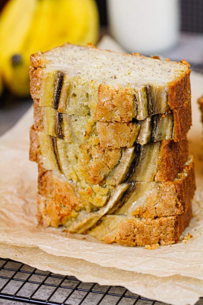 banana bread loaf sliced and stacked to show how pretty and delicious it is
