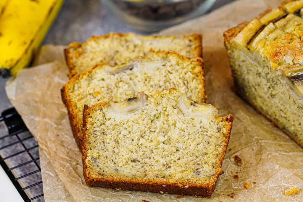 image of banana bread slices, stacked to show how soft and moist they are
