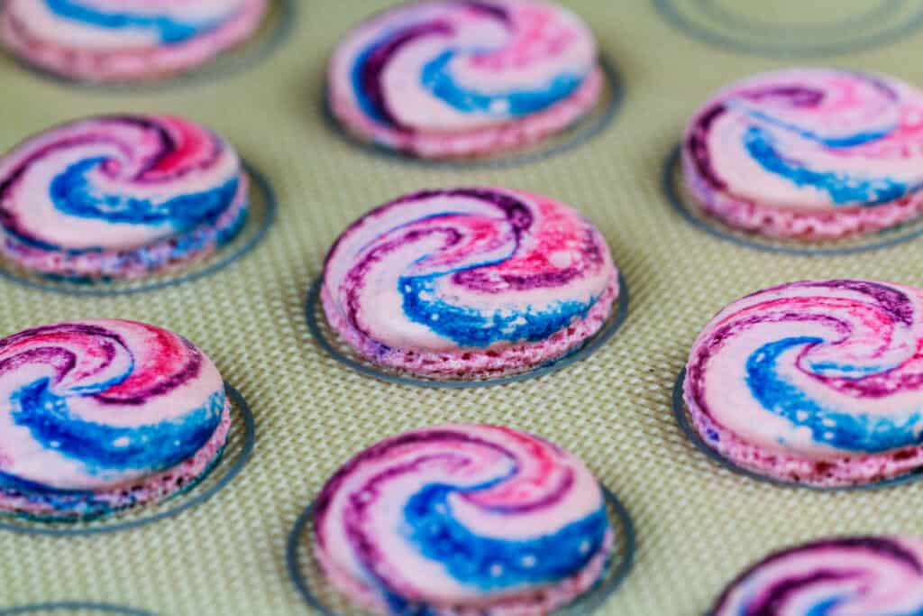 image of baked cotton candy colored macaron shells