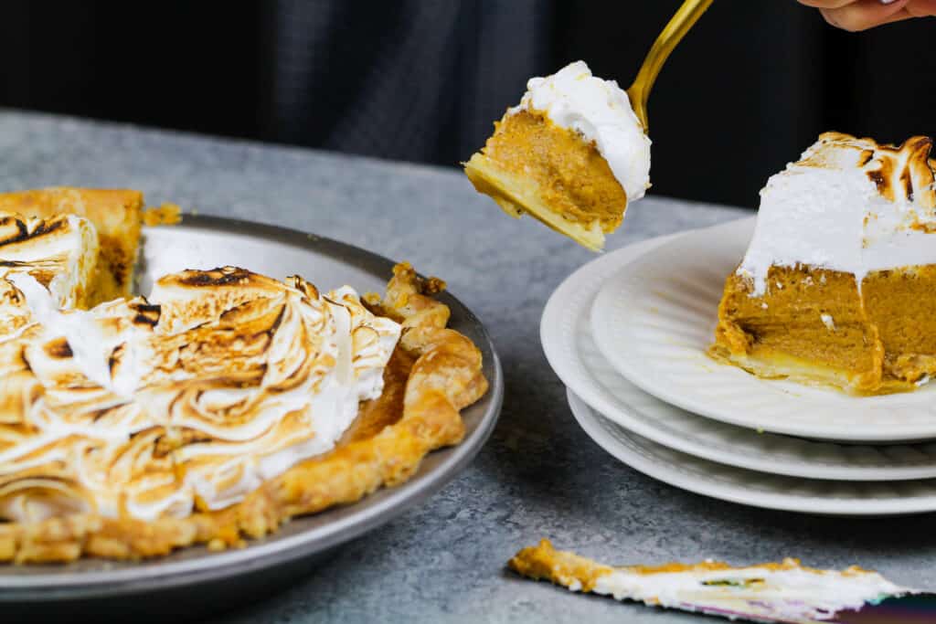 image of a mascarpone pumpkin pie slice that's been cut into to show how creamy it is
